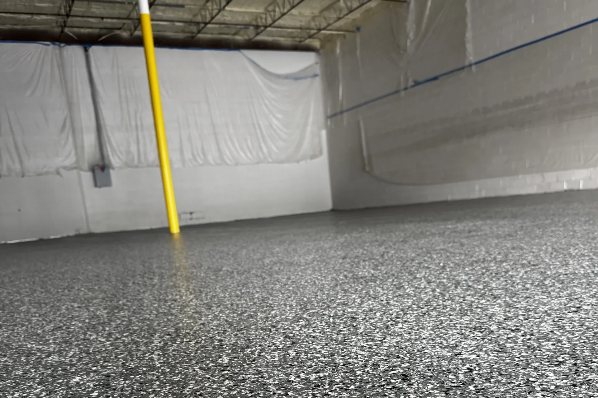 Gray flake epoxy floor coating in a garage